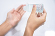 © PhotobyTawat - Close up of hands washing by sanitizer gel pump bottle, alcohol gel for prevention coronavirus disesse 2019 (COVID-19), bacteria and germ, health care concept (select focus)