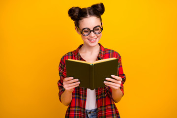 Sticker - Photo of pretty crazy lady two buns hold open book diligent student interesting story novel wear geek vision specs casual checkered shirt isolated yellow color background