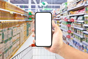 hand holding blank screen smartphone in the supermarket