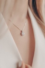 Woman Wearing Elegant Pendant Necklace With Diamond On Close-up