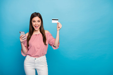 Sticker - Portrait of her she nice attractive lovely pretty fashionable cheerful cheery girl using cell bank card buying goods online isolated over bright vivid shine vibrant blue color background