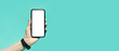 © Lalandrew - Male hand holding smartphone with mockup on panoramic background of cyan color with copy space.