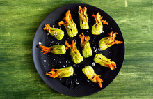 Overhead View Of Squash Blossoms With Burrata And Tapenade