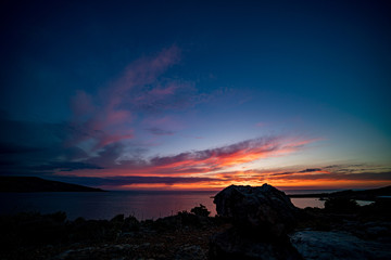 Poster - Beautiful dramatic sky during sunset over the sea