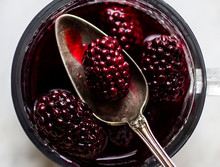 Close Up Of Blackberry Verbena Syrup And Spoon