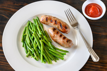 Wall Mural - Fried green beans with grilled sausages