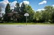 Outdoor basketball court with net removed from backboard due to Covid 19 pandemic