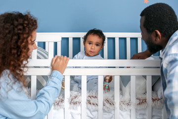 Sticker - Happy African-American parents with cute baby at home