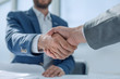 © ASDF - close up. young business people shaking hands.