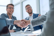 © ASDF - close up. businessmen confirming the deal with a handshake.