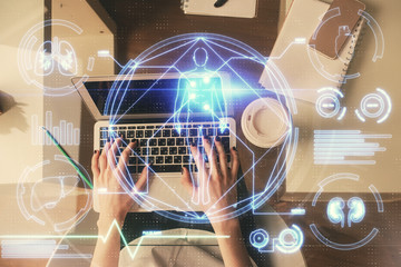 Aufkleber - Double exposure of woman hands working on computer and education theme hologram drawing. Top View. Science concept.