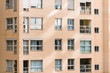 © Road Red Runner - Overcrowded brick buildings with clean square windows.