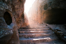Steps Amidst Rock Formations Against Sky