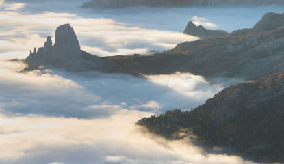 Wall Mural - View of famous Dolomites mountain peaks glowing in beautiful golden morning light at sunrise in summer, South Tyrol,Italy
dramatic view of dolomites mountains above the clouds
Famous best alpine place