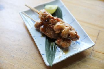 Wall Mural - japanese food , Chicken yakitori on wood background