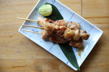 Wall Mural - japanese food , Chicken yakitori on wood background