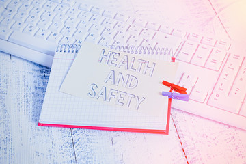 Poster - Text sign showing Health And Safety. Business photo text procedures intended to prevent accident in workplace notebook paper reminder clothespin pinned sheet white keyboard light wooden