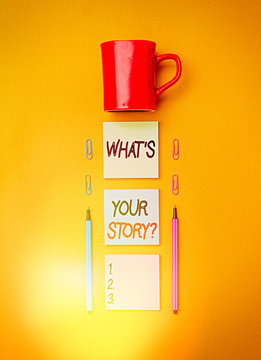 Handwriting text writing What Is Your Storyquestion. Conceptual photo manner of asking demonstrating about past life events Coffee cup blank colored sticky note two ballpoints clips yolk background