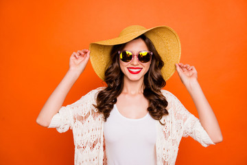 Wall Mural - Photo of cheerful white nice curly wavy brunet haired woman smiling toothily beaming into camera shiny wearing eyewear eyeglasses isolated over vivid color background