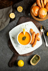 Canvas Print - lentil soup with a slice of lemon sprinkled with dried mint