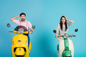 Poster - Surprised impressed tow people bikers man woman drive motor bike touch heads hands look incredible nature view scream wow omg wear formalwear clothes isolated over blue color background