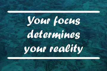 Wall Mural - Inspirational quote on the sea background. Your focus determine your reality