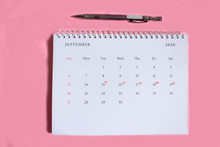 Marked Calendar With Marker On Pink Background.