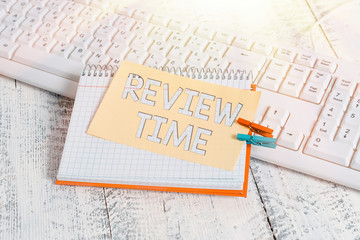 Text sign showing Review Time. Business photo text to think or talk about something again Set schedule to review notebook paper reminder clothespin pinned sheet white keyboard light wooden