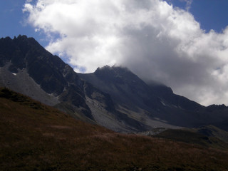 View of a beautiful mountain, probably the 'Têtes des Bellaval', with clouds and blue sky.