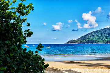 Wall Mural - View of beautiful crystal clear water and gold beach with boats in summer of tropical island in in Malaysia. Travel, adventure, summer vacation.