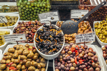 Sticker - Varieties of olives for sale on covered food market - Mercato Delle Erbe in historic part of Bologna city, Italy