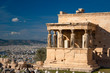 The Erechtheum temple stone porch with caryatids in Erechtheion in Acropolis, Athens in Greece with city view