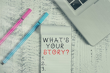 Poster - Conceptual hand writing showing What Is Your Story question. Concept meaning being asked by someone about my own journey from beginning till now Trendy laptop blank ruled notepad pens lying wooden