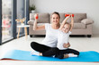 © FreepikCompany - Front view of mother with daughter posing while holding weights