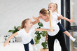 © FreepikCompany - Mother and daughters at home exercising