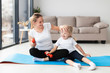 © FreepikCompany - Happy mother with daughter on yoga mat at home