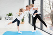 © FreepikCompany - Side view of mother practicing yoga with daughters
