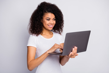 Wall Mural - Close-up portrait of her she nice attractive lovely cheerful cheery wavy-haired girl holding in hands using laptop working remotely isolated over light white pastel color background
