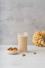 Wall Mural - A glass of almond milk. Healthy protein drink suitale for vegans. Dairy alternative