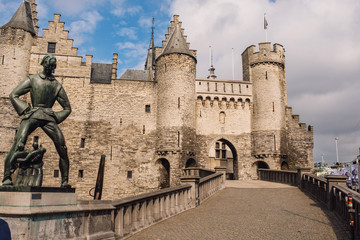 Statue of Lange Wapper in front of the castle in Antwerpen. Lange Wapper is a legend about a giant who irritates people, children, drunkards, and loose women.