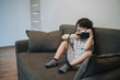 © ces - Beautiful smiling child (kid, boy) - photographer holding a instant camera intdoors