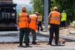 © andrey2017 - asphalt laying, workers in overalls