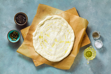 Wall Mural - pizza dough on the table. cooking italian food