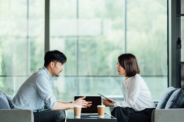 Wall Mural - Young Asian business man and woman