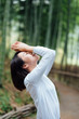 © JodieWang - Young Asian women in bamboo forest