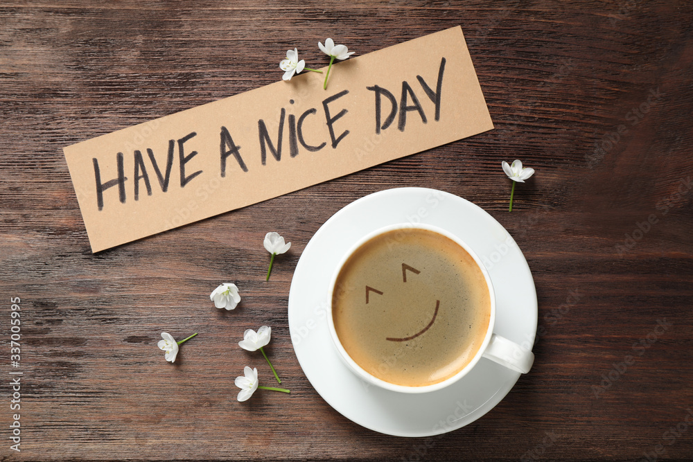 Delicious coffee, flowers and card with HAVE A NICE DAY wish on wooden table, flat lay. Good morning - obrazy, fototapety, plakaty 