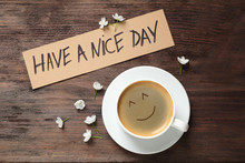 Delicious Coffee, Flowers And Card With HAVE A NICE DAY Wish On Wooden Table, Flat Lay. Good Morning