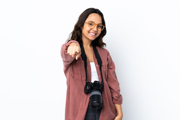 Young photographer woman over isolated white background pointing front with happy expression