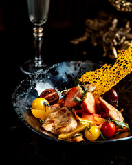 Canvas Print - fried chicken breast with sliced fruits and vegetables