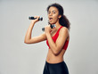 © SHOTPRIME STUDIO - young woman holding a dumbbell